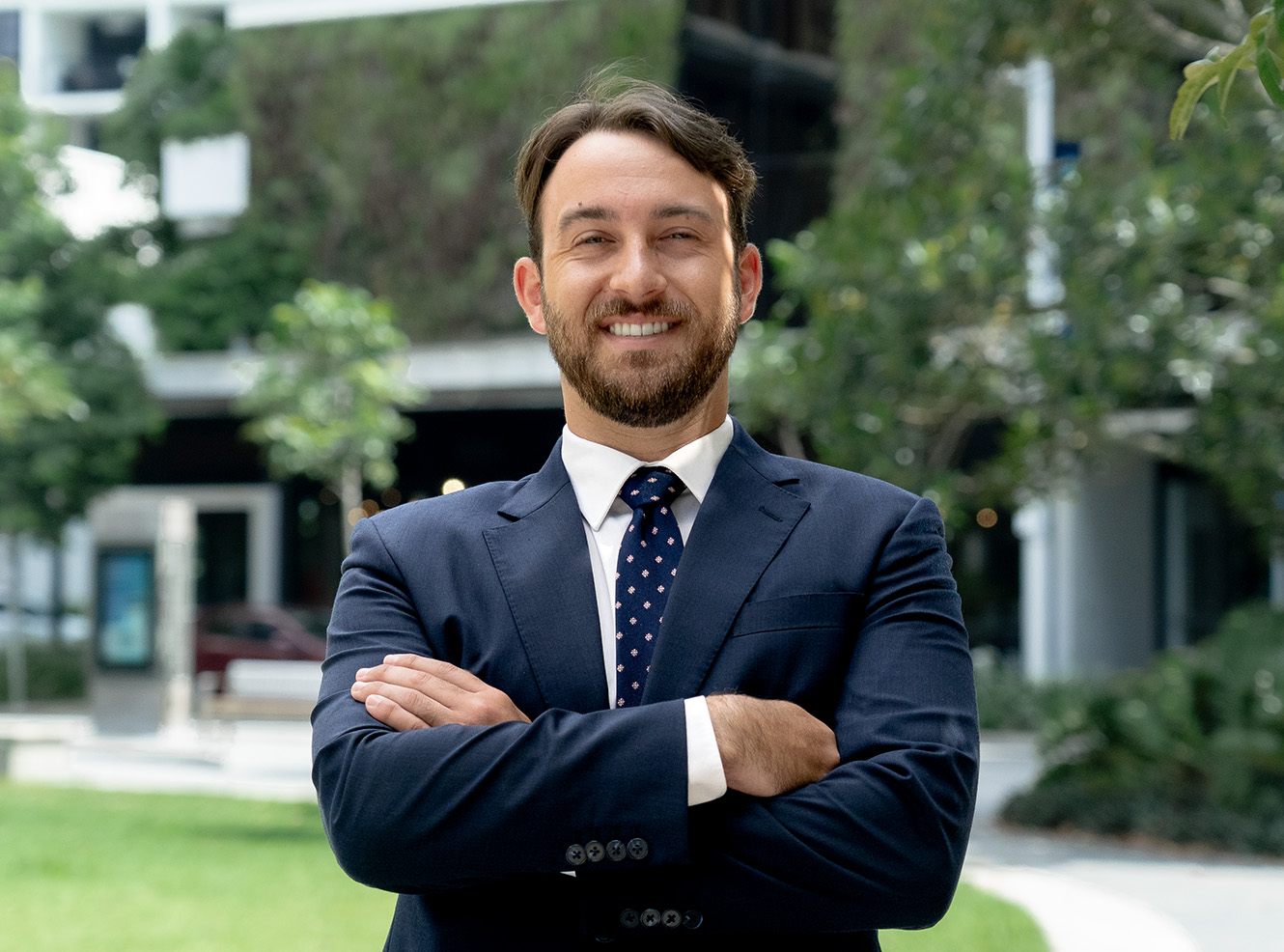Lawyer, CHRISTOPHER HOLLAND, outside of Axia Litigation Lawyers office in Maroochydore