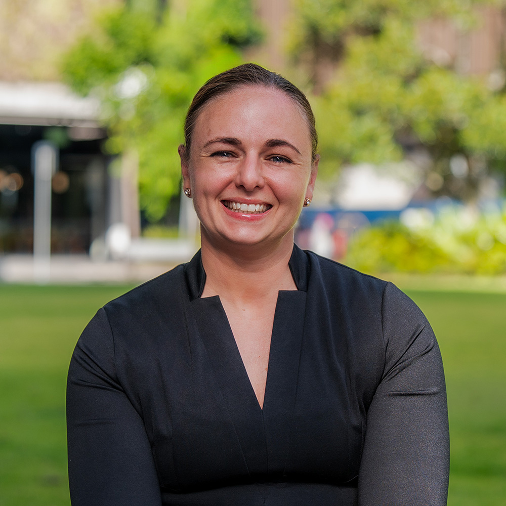 Lawyer Sammy-Lee sitting in park outside Axia Litigation Lawyers office Sunshine Coast